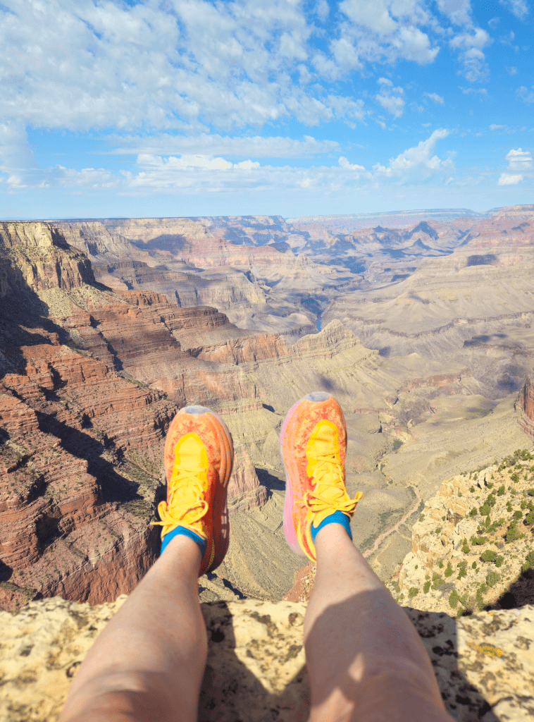 Hoka Speedgoat 6 hanging over the edge of the Grand Canyon